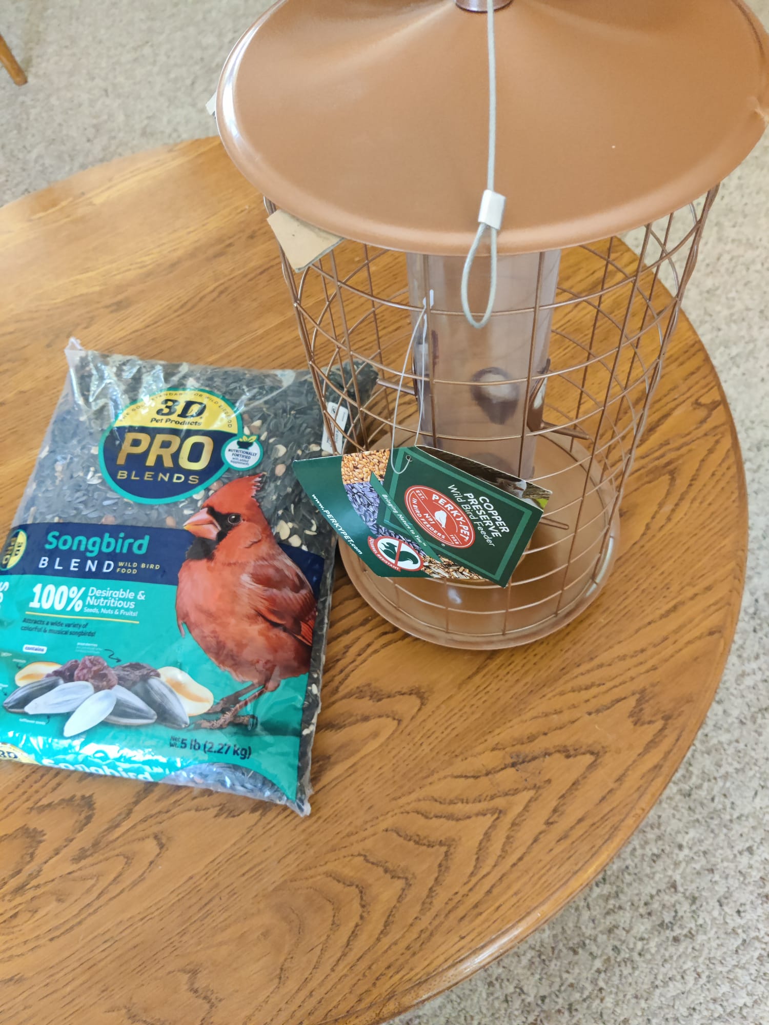Bird feeder and bag of bird seed